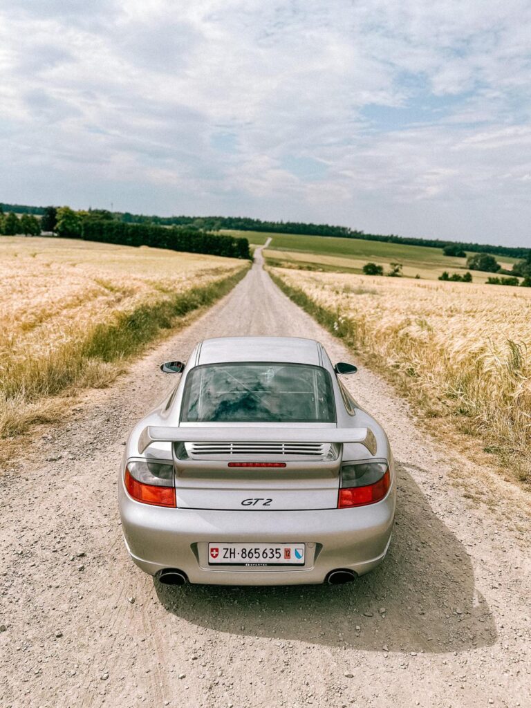 Porsche on a dirt road near the Rhein River in Germany